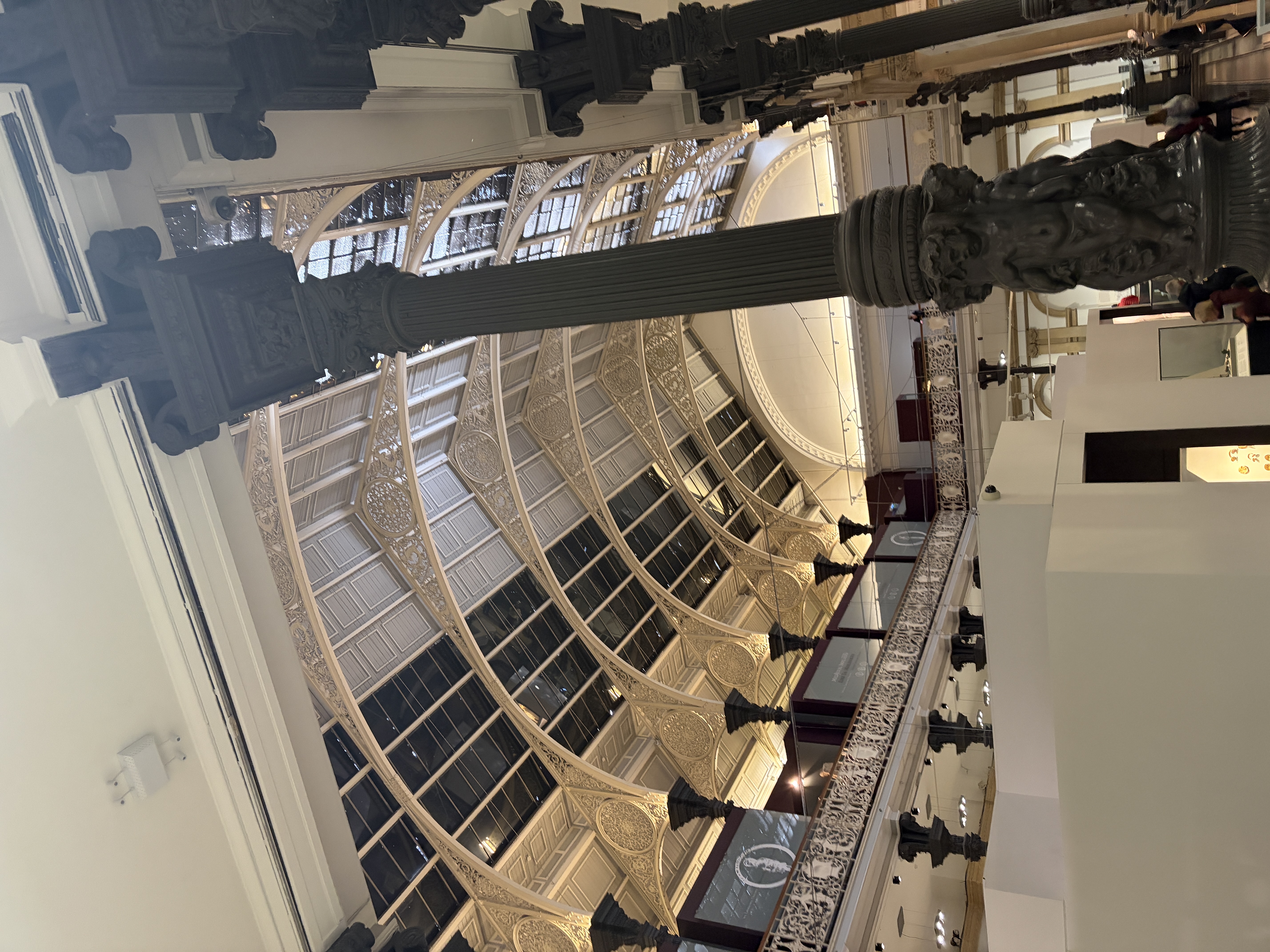the ceiling of the museum, which is arched and has ornate metal work